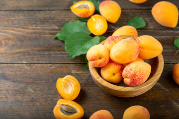 Naklejka na ściany i meble Delicious ripe apricots and leaves