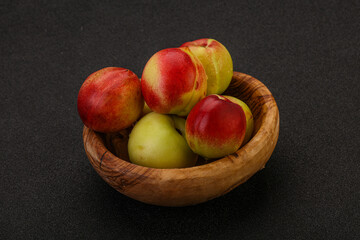 Sweet small nectarines in the basket