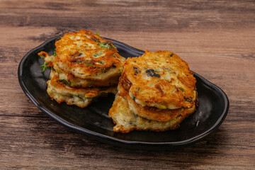 Zucchini pancakes with herbs and spices