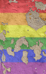 Rainbow colored LGBT pride flag painted on an old and weathered concrete wall, paint is peeling off. High resolution full frame textured background of a colorful concrete wall. Copy space.
