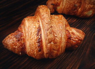 Croissant on a wooden board. Fresh bakery .