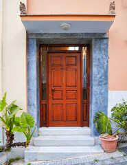 Fototapeta na wymiar contemporarry house front entrance natural wood door