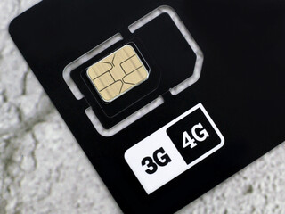 mobile phone sim card macro shot so close, black color. 3G and 4G