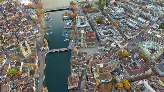 Aerial drone view of Zurich city centered where the old town around the Limmat river lies next to the business and financial district and the Parade Platz in Switzerland