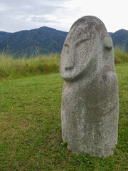 Side view of mysterious ancient megalith know as Loga in Lore Lindu National Park, Bada or Napu...