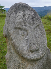 Close up view of the face of mysterious ancient megalith know as Loga in Lore Lindu National Park,...