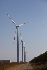 Row of wind farms in the field