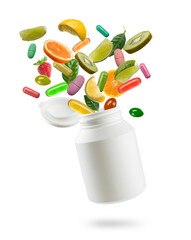 Fototapeta na wymiar Plastic bottle with pills, tablets and citrus fruits jumping out on white background