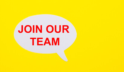 On a bright yellow background, white paper with the words JOIN OUR TEAM