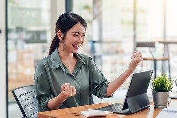 Asian businesswoman Smiling happy are successful in office work.