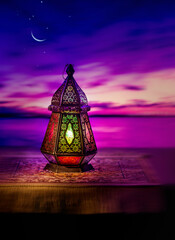 Beautiful Eid moon in the evening sky with an illuminated Egyptian lantern on the foreground. Ramadan greeting card photo with clear space for text.