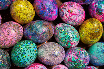 Many colorful shiny eggs. Concept of Happy Easter.