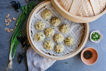 Fototapeta premium Delicious homemade Chinese cuisine / Steamed Baozi with Black Fungus and Dried Shrimps / Uncooked baozi can be frozen for later use. Steamed and eaten with soy sauce or chili oil
