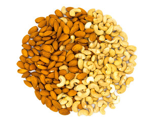 Cashew and almond round bunch on white background. Natural organic nut kernel. Protein superfood or healthy snack. Nuts pile scattered on white table top view. Granola package design. Healthy eating