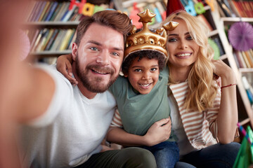 Happy caucasian couple with adopted afro american child
