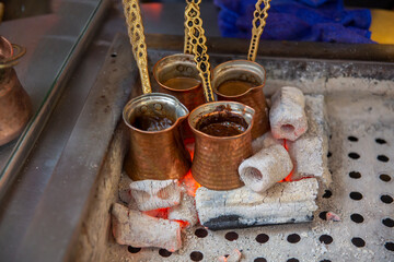 Front view traditional Turkish coffee cooked in embers