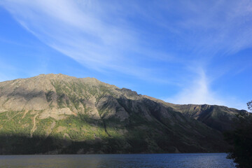 incredible view on lake called windy arm, and surrounding mountains in canadian wilderness, path...
