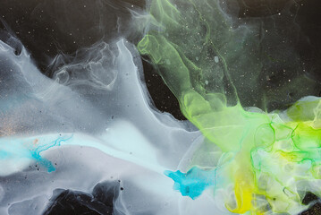 Fototapeta premium Currents of translucent hues, snaking metallic swirls, and foamy sprays of color shape the space and sea of these free-flowing textures. The marbling techniques, alcohol ink, modern abstract painting 