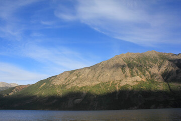 incredible view on lake called windy arm, and surrounding mountains in canadian wilderness, path...