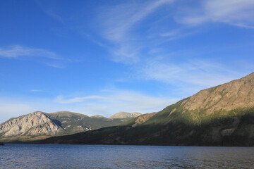 incredible view on lake called windy arm, and surrounding mountains in canadian wilderness, path...