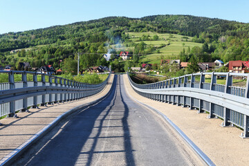 Fototapeta na wymiar LUBIEN, POLAND - AUGUST 17, 2020: Bridge over the river