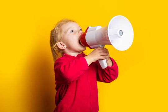Child Screaming Megaphone Looks Up On Bright Yellow Background