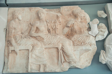 Section of an ancient marble frieze in a museum in Athens, Greece