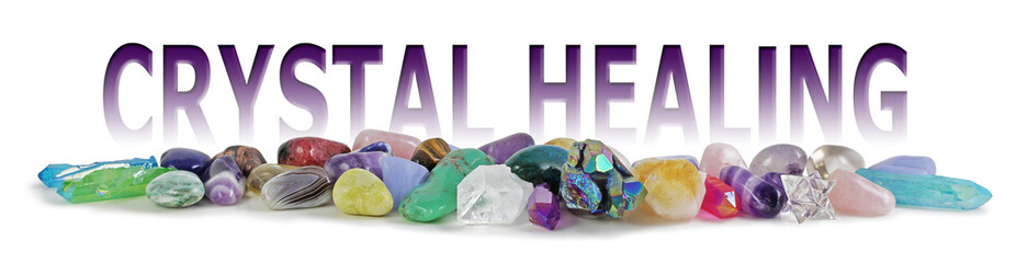Crystal Healing Tumbled Stones Banner - wide selection of tumbled healing stones laid in a neat row...
