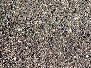 Volcanic rock road to Mutnovsky volcano. Macro shot of volcanic pebbles and sand lining the road....