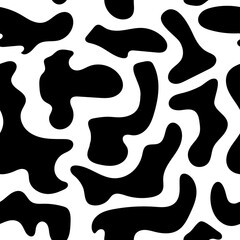 Seamless abstract cow pattern. Stylish simple vector texture - white background with black shapeless spots. Background, wallpaper, fabric, textile, dalmatian print, white pattern with black spots.