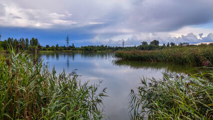 Landscape with a view of the lake and a beautiful sky with clouds above it
