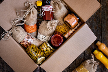Volunteer with box of food for poor . Ramazan kolisi . Donation concept .
