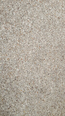 Small stones made of ground, brown, gray, white arranged in detail. Can be background