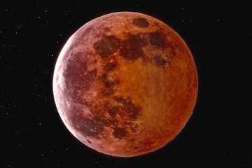 The picture shows the blood moon with stars over the city of Bottrop in North Rhine-Westphalia with a clear night sky.