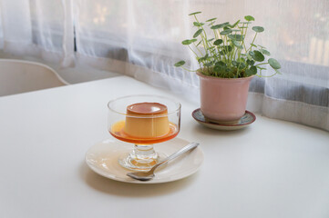 High angle view of dessert  caramel custard pudding in plate on table