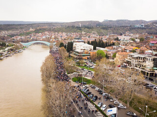Tbilisi,Georgia - 9th april, 2021: People walking road Protest demonstration in street with city...