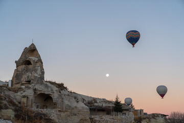 Fototapeta na wymiar Hot air balloons at sunrise in Cappadocia. A popular tourist hotspot in Turkey