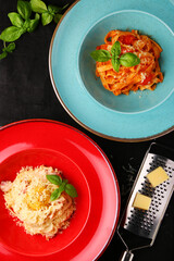 various pasta top view with cheese grater parmesan and basil leaf.