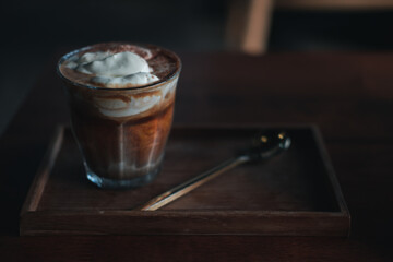Black coffee on top with vanilla ice cream