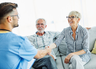 Obraz premium nurse doctor senior care caregiver help assistence retirement home hospital nursing man handshake insurance