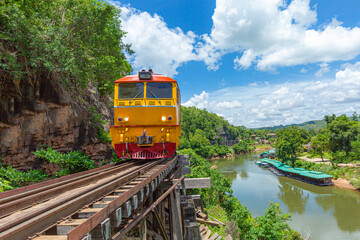 trains running on death railways track crossing kwai river in kanchanaburi thailand this railways important destination of world war II history builted by soldier prisoners