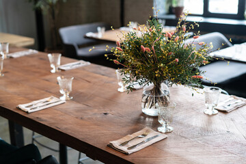 Served table in an empty restaurant. Pandemic concept.