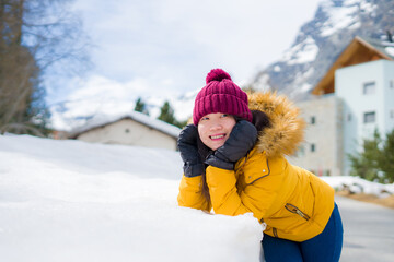 Fototapeta na wymiar winter lifestyle portrait of young happy and attractive Asian Korean woman at beautiful snow mountains landscape enjoying Easter holidays in Swiss Alps smiling cheerful