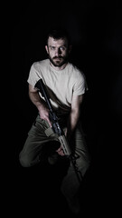 Fototapeta premium Portrait of an American Army veteran holding an AR15 Rifle.