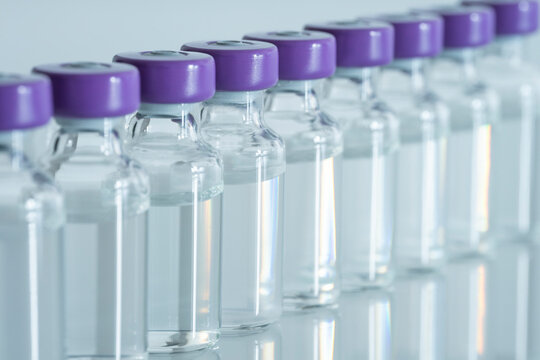 MANY VIALS OF COVID VACCINES LINED UP. GLOBAL VACCINATION CAMPAIGN AGAINST CORONAVIRUS PANDEMIC. CENTAURUS SUB VARIANT.