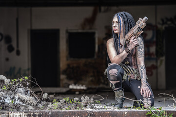 Tattooed gun girl in end time scenery