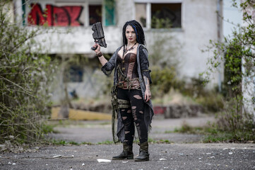 Beautiful woman in leather wear in end time