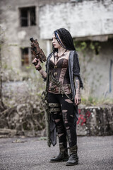 End time scenery with tattooed gun girl