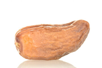Dried organic light brown date, close-up, isolated on white.