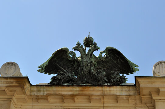 Urban sculpture. Image of a two-headed eagle on the roof of an old house.